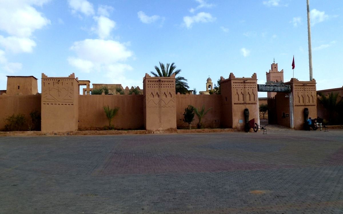 Earthen walls and towers of the Ouarzazate cinema museum entrance on the square opposite Kasbah Taourirt