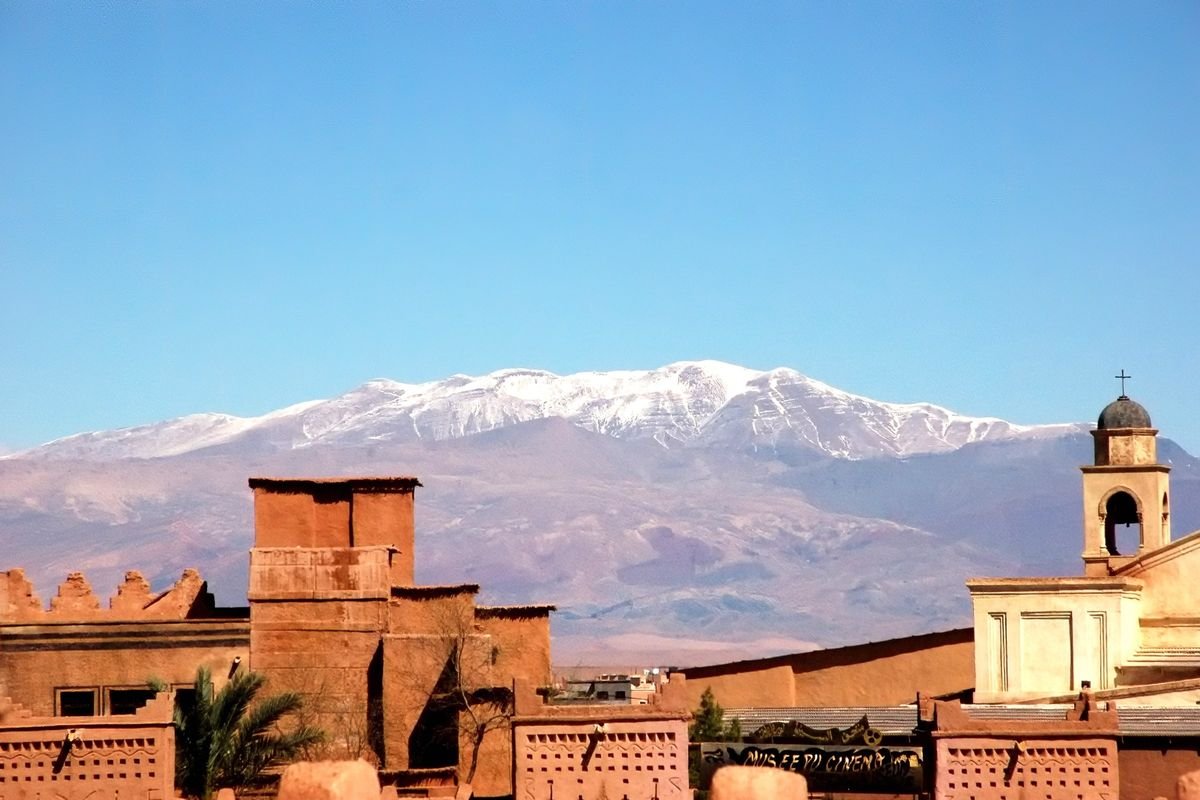 Rooftops of Ouarzazate with the snow-capped High Atlas behind