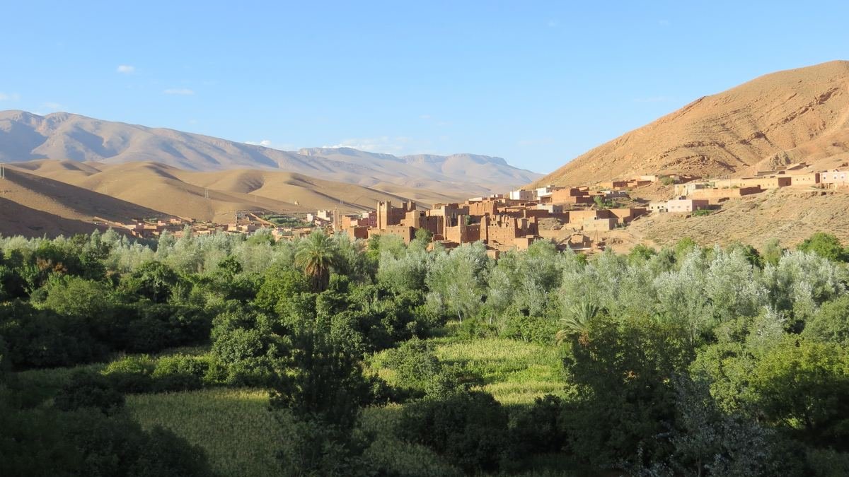 Old earthen kasbahs above the green fields near Aït Arbi in the lower Dades valley