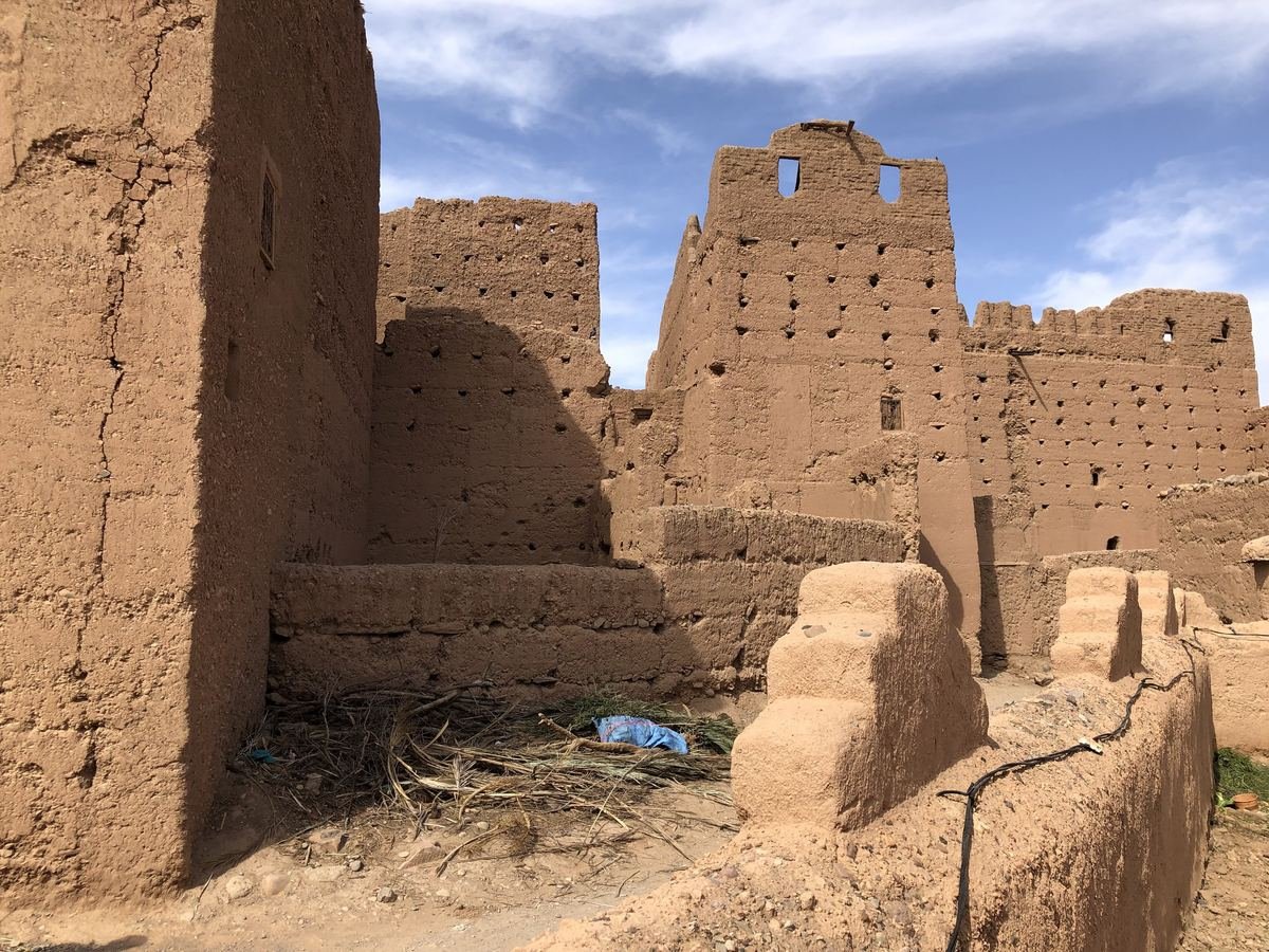 Crumbling earthen walls and towers of the ksar of Tamnougalt